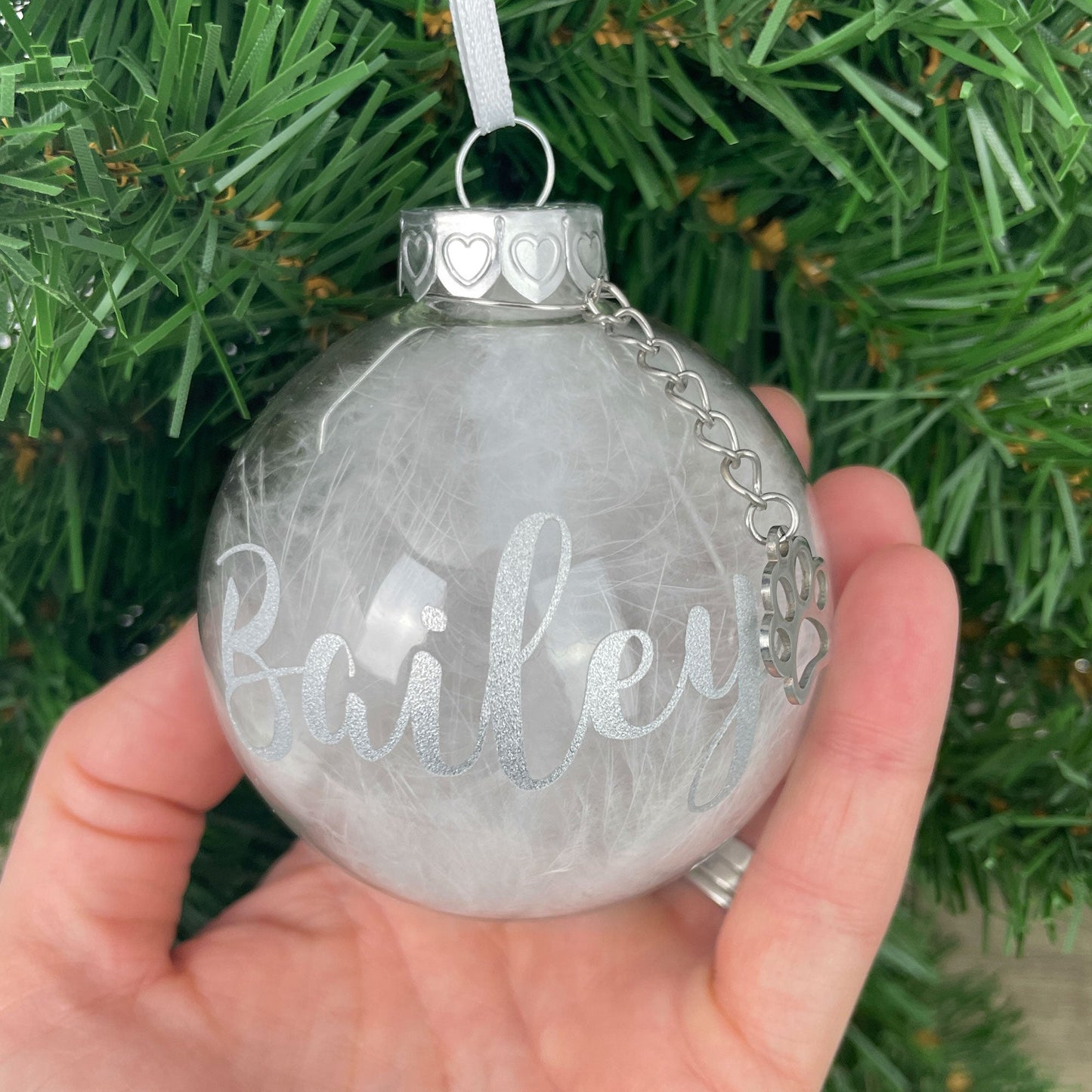 Personalised White Feather Filled Glass Pet Memorial Bauble With Paw Charm